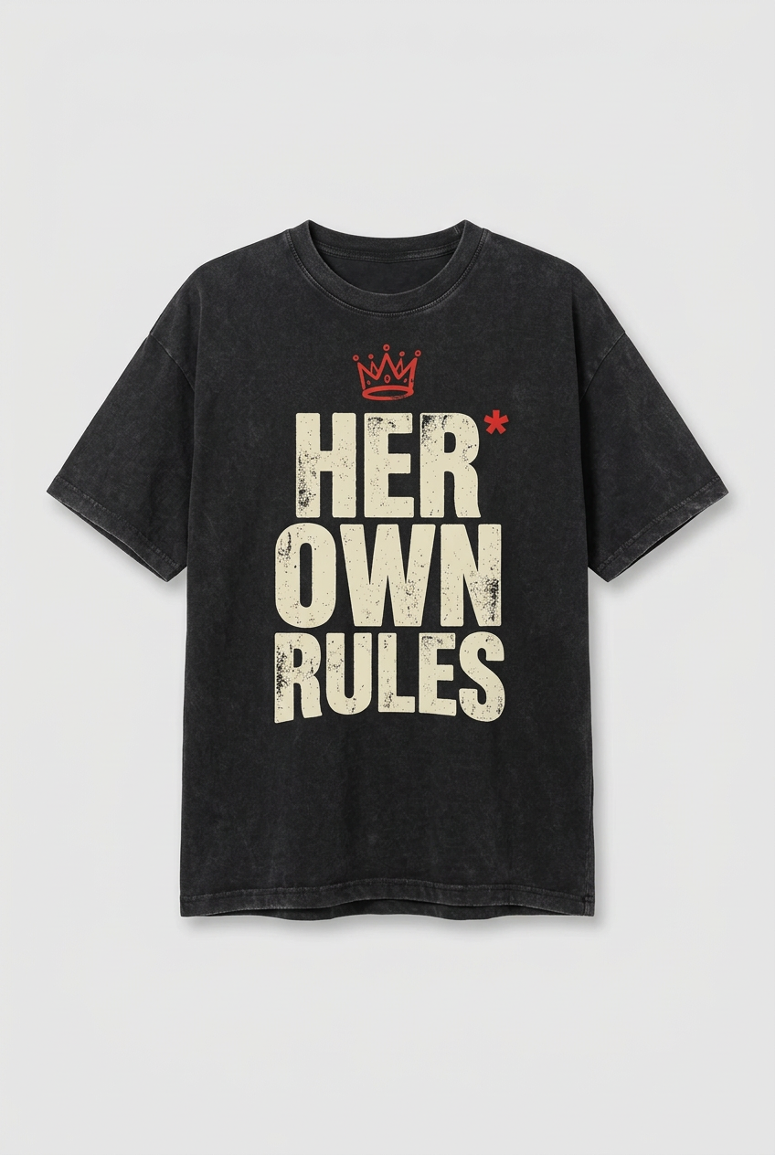 Flat-lay mockup of a charcoal Her Own Rules graphic T-shirt with a smaller centred print