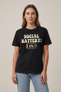 Model wearing the black Social Battery 1% graphic tee, untucked