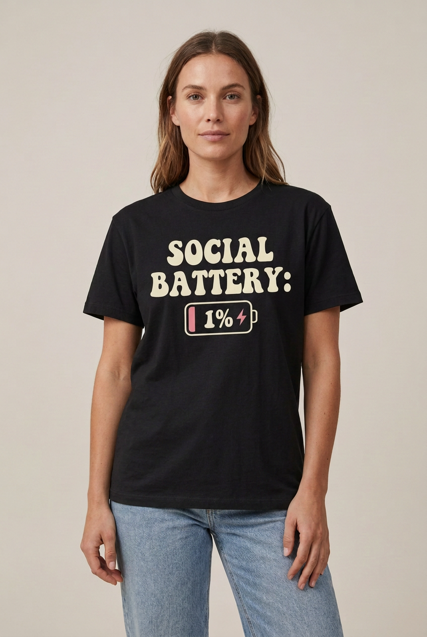 Model wearing the black Social Battery 1% graphic tee, untucked
