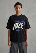 NIZE graphic on a model wearing a black oversized tee